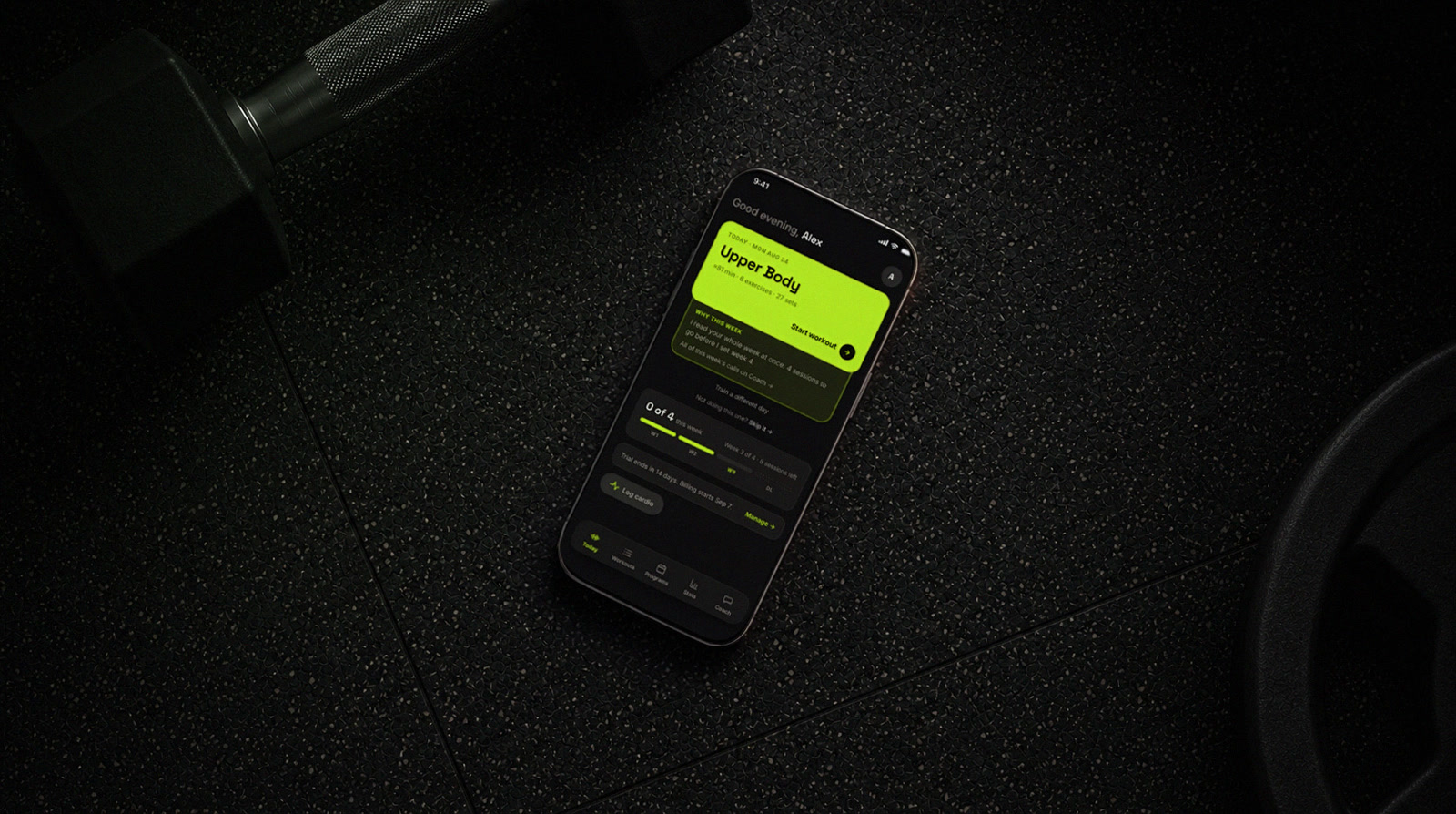 LIFT open on a phone resting on a gym floor beside a weight plate